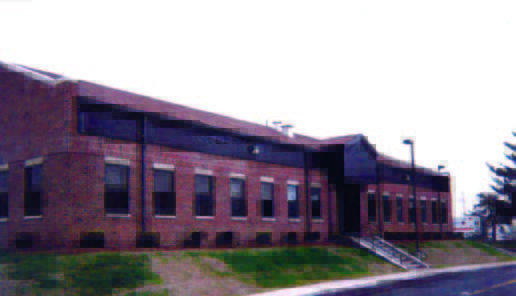 westover (2) A single-story red brick building with multiple windows and a ramp leading to the entrance.