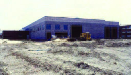 winthrop (2) A partially constructed building with construction equipment and dirt in the foreground.